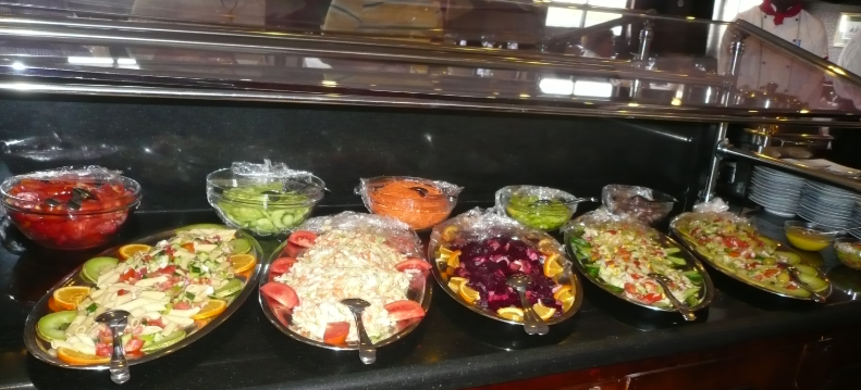 several plates of assorded cold salada