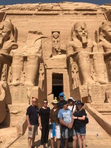group of 8 people in front of entrance to Abu Simbel Temple