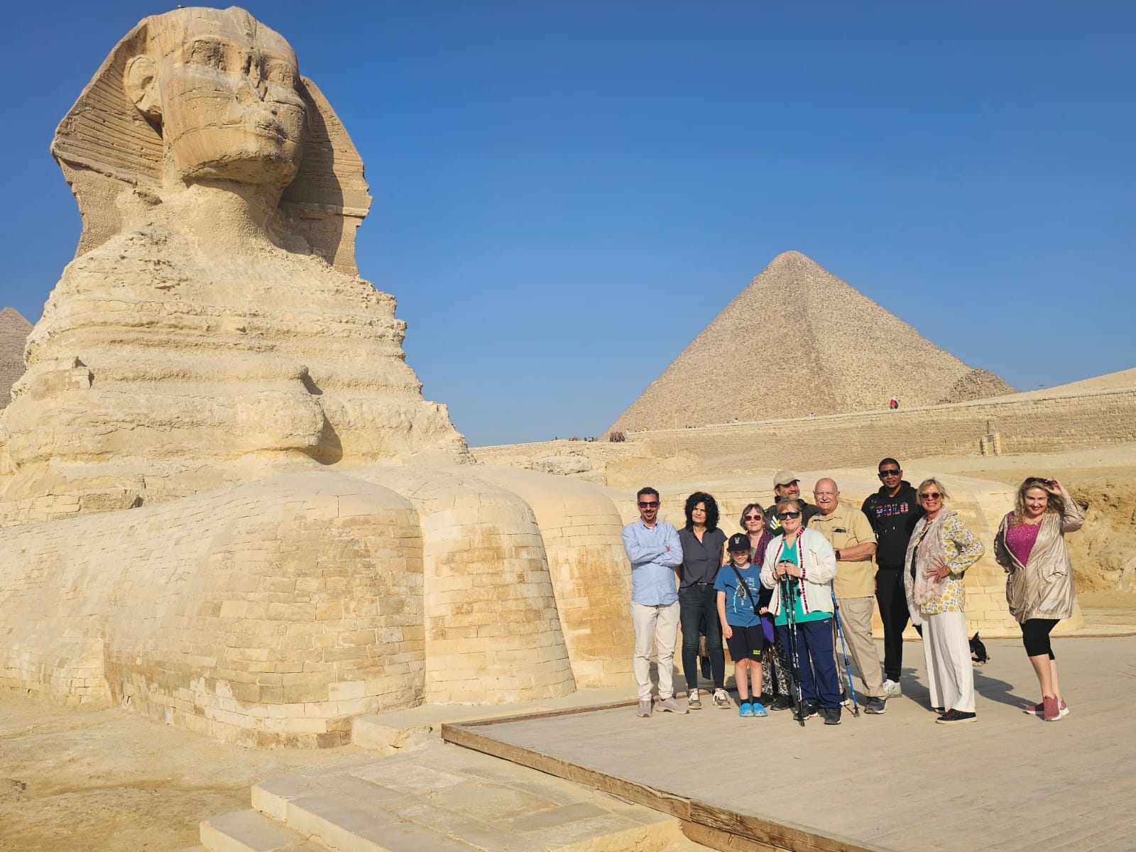 Mara House Egypt group with private access standing between the paws of the Great Sphinx