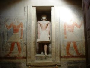 Tomb of Mereruka at Saqqara, showing statue of Meruka set into a large opening in the wall - full colour