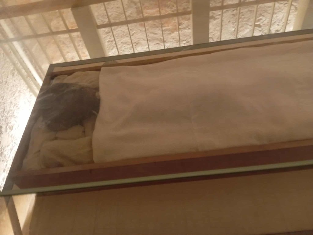 mummy of King Tutankhamun in his tomb in the Valley of the Kings, Luxor, Egypt