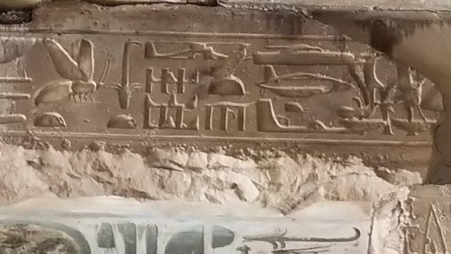 Relief carving at Abydos Temple showing hieroglyphs that resemble a helicopter, submarine, and stealth fighter